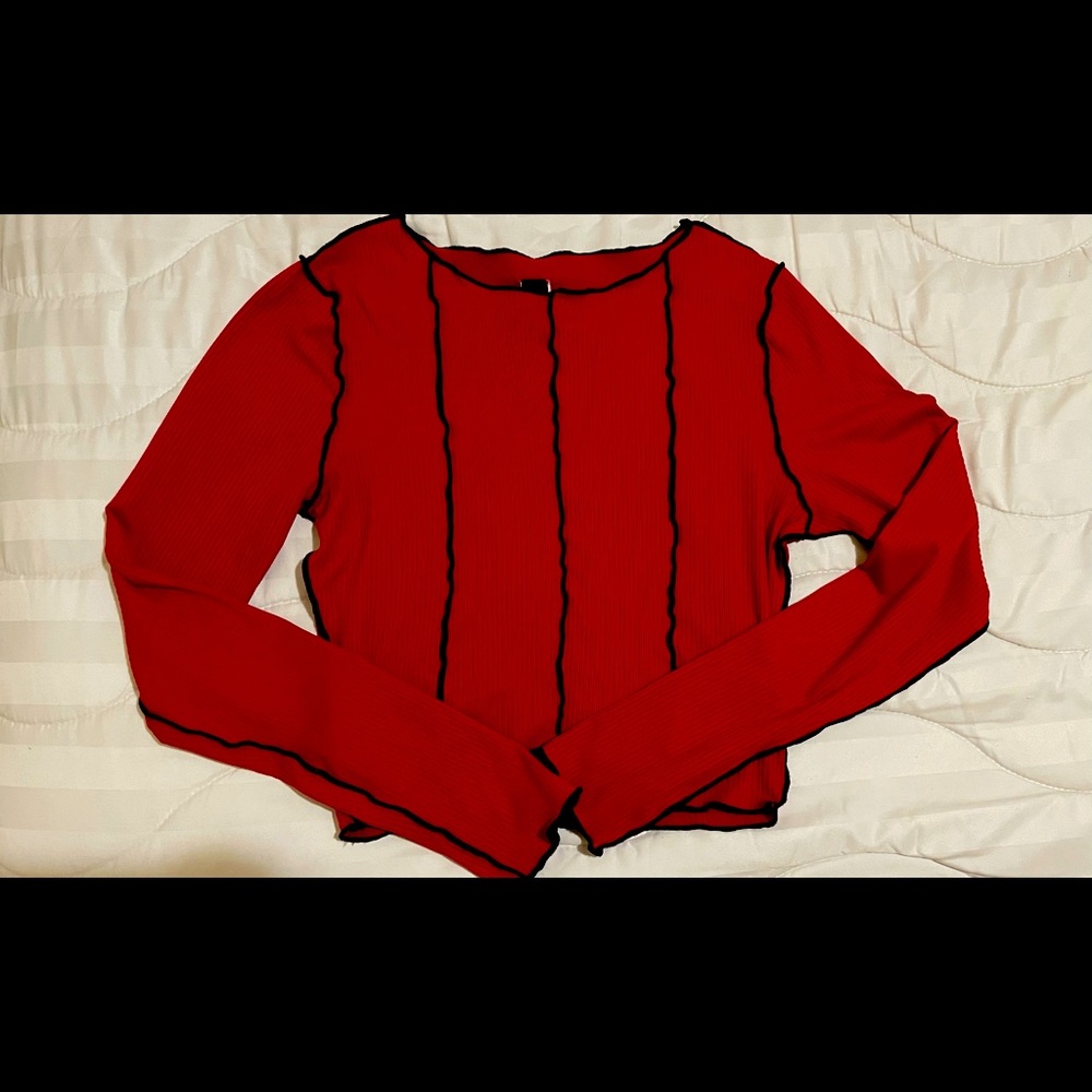 Red long sleeve top.